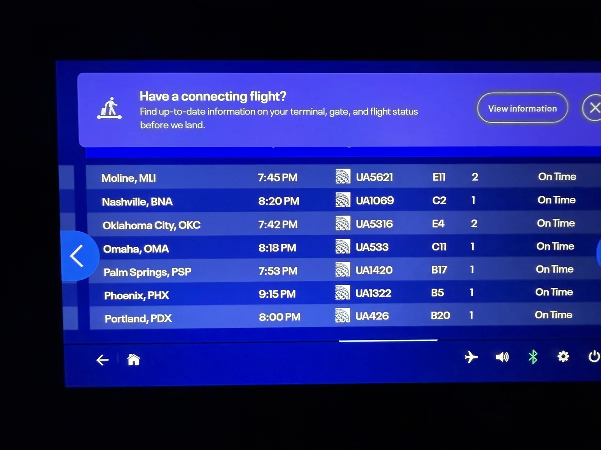 An airport departures board listing multiple destinations